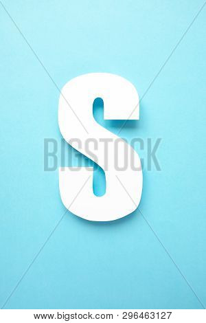 Letter S Cut From Paper On Blue Background