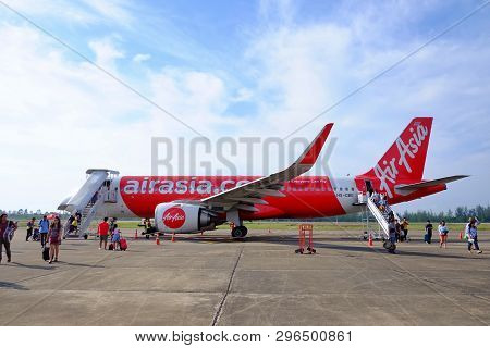 Chumphon, Thailand - April 10,2019 : Thai Air Asia At Chumphon Airport With Passengers Walking On Th