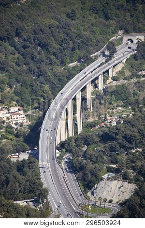 Menton, France - April 19, 2019: Aerial View Of Cars Traffic Moving On A Highway Bridge With Pillars