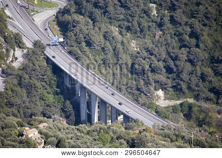 Menton, France - April 19, 2019: Aerial View Cars Traffic On A Highway Bridge With Pillars And Freew