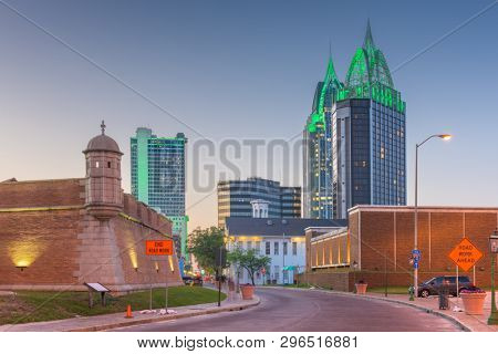 Mobile, Alabama, USA downtown skyline with Fort Conde at dusk.