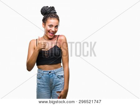 Young braided hair african american with pigmentation blemish birth mark over isolated background doing happy thumbs up gesture with hand. Approving expression looking at the camera