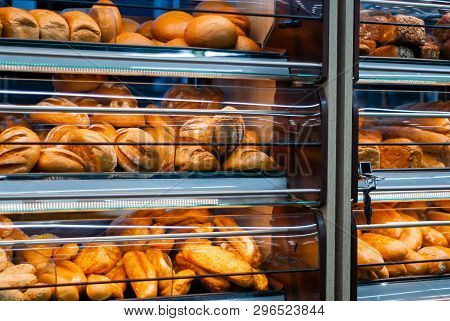 Background - Shelves In A Grocery Store With Fresh Bread Of Different Varieties