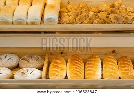 Background - Shelves In A Bakery With Fresh Bread Of Different Varieties