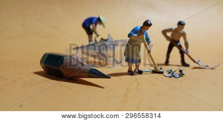2 Man And 1 Woman Cleaning Trash From Pencil Sharpener With Negative Space