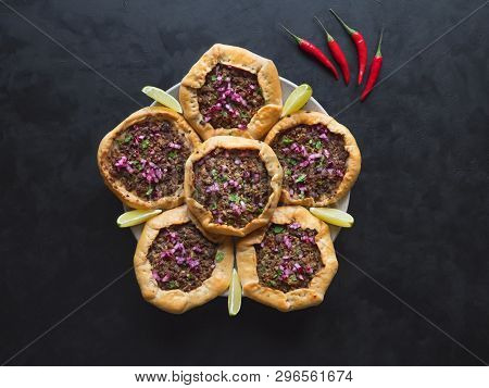 Open Meat Pies On A Black Background. Top View