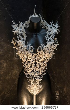 Piece made with 3d printer, is composed of white flowers that form a corset, handmade, fantasy design Baroque style