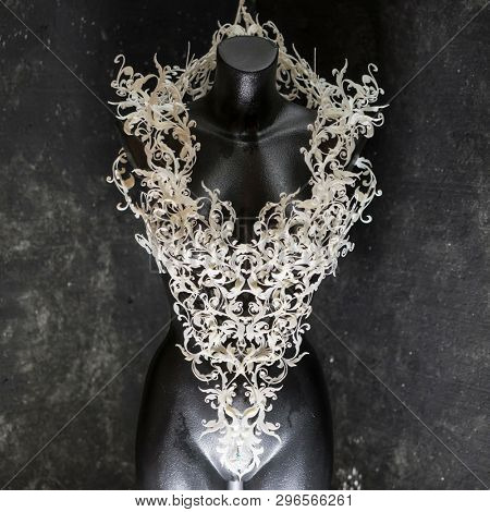 Manikin, Piece made with 3d printer, is composed of white flowers that form a corset, handmade, fantasy design Baroque style