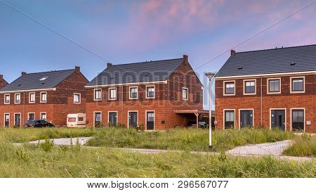 Street With Modern Family Houses In Urban Suburb In The Netherlands