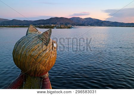 Traditional Totora Reed Boat With Puma Head Prow Against Lake Titicaca At Sunset, Puno, Peru
