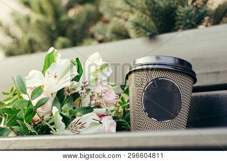 Wedding Bouquet Of Flowers With A Cup Of Coffee On A Wooden Table.