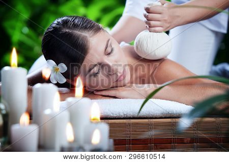 Portrait Of Young Beautiful Woman In Spa Environment.