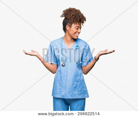 Young african american doctor woman over isolated background Smiling showing both hands open palms, presenting and advertising comparison and balance