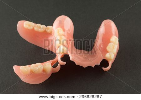 Large Image Of A Modern Nylon Denture On A Black Background