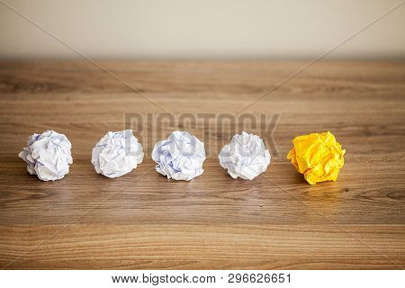 Great Idea Concept. Crumpled Colorful Paper On Wooden Table