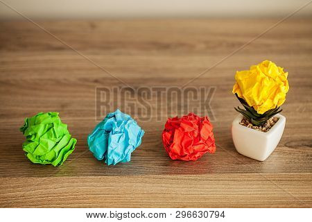 Great Idea Concept. Crumpled Colorful Paper On Wooden Table