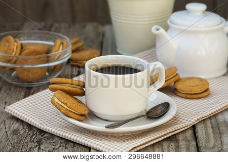 Cup Of Coffee With Sweet Cookies, Ginger Bread. Abstract Breakfast Image. Rustick Wooden Background.