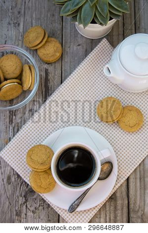 Cup Of Coffee With Sweet Cookies, Ginger Bread. Abstract Breakfast Image. Rustick Wooden Background.
