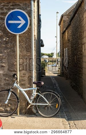 Barfleur, France - August 29, 2018: Medieval Granite Houses And Bikes In Barfleur. Normandy France