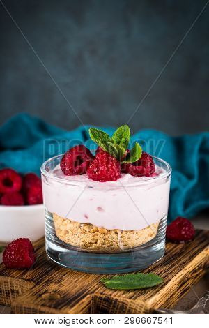 No Baked Cheesecake With Raspberry In Glass Jar. Healthy Dessert.