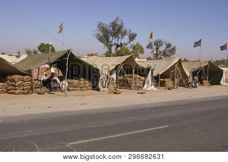 Nagaur, Rajasthan, India - February 14, 2008: Selling chili by the sack at the annual livestock festival in Nagaur, Rajasthan, India.