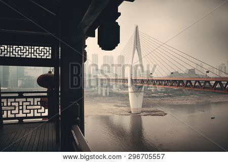 Hongyadong complex with bridge and city urban architecture in Chongqing, China.