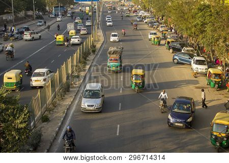 Delhi India - 09.02.2019 Indian City Traffic Of Various Moto And Motor Vehicles Against The Backgrou