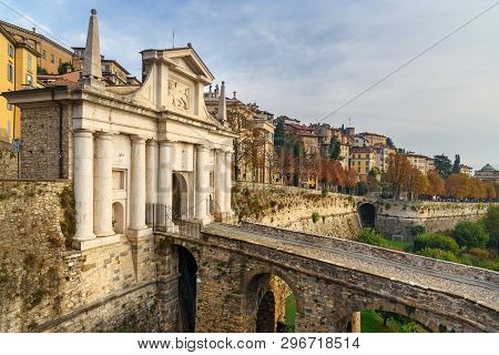 View Of Bergamo City With Porta San Giacomo Gate, Sant Andrea Platform Of Venetian Walls At Morning.