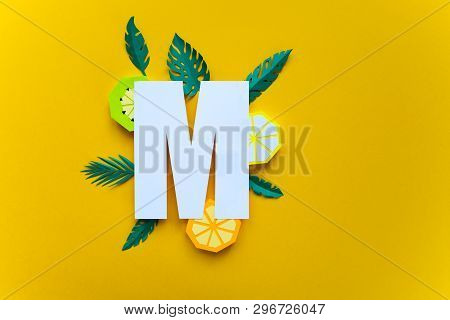 Letter M Cut From Paper With Tropical Fruit Paper