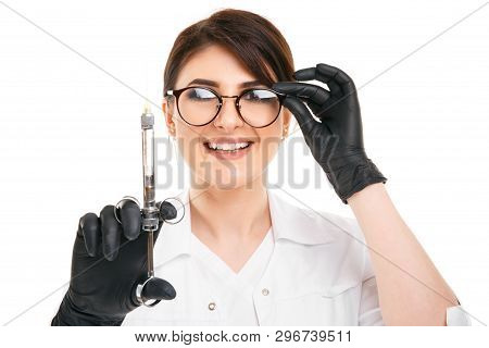 Closeup Photo Of Female Dentist Holding Oral Syringe Isolated Over The White Backgrownd.