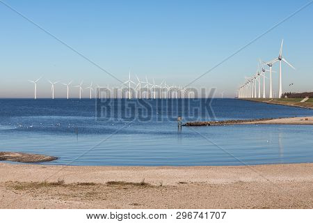 View At Off Shore Wind Turbine Farm From Beach Former Island Urk, The Netherlands