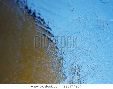 Thin Icy Board Against Strong Sun Light. In Ice Floe Are Visible Deep Cracks. Melting Of Arctic Ice