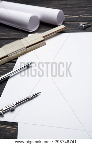 On The Black Wooden Desk Are Tools For Creating Drawings