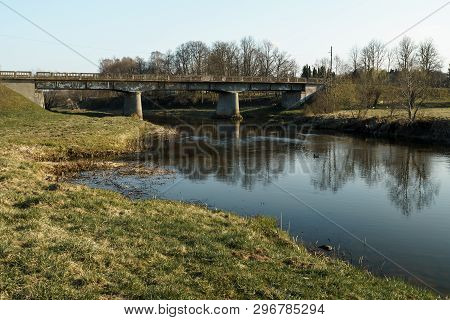 River With A Bridge In The Backround In Sabile, Latvia