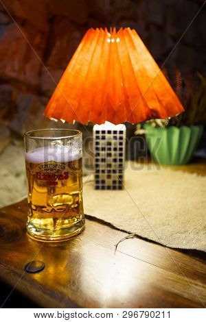 Sabile, Latvia - April 21, 2019: Glass Of Uzavas Light Beer At A Krogs Restaurant