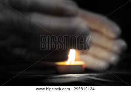 Memorial Day International Holocaust Remembrance Day On Memorial Day, A Man S Hand Holds A Candle Cl