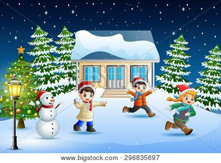 Happy Kids Wearing A Winter Clotes Playing A Snow In Christmas Day