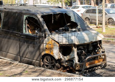 Fully Burned Minivan Abandoned On The Side Of A Street