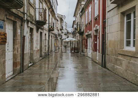 Sarria, Spain - April 6th, 2019: Perspective Of A Popular Street In Sarria Village Center, In A Rain