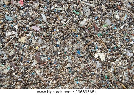 Micro Plastics Marine Debris On The Sand Beach.