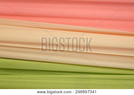 lime green, cream and salmon crepe paper - background with crinkled texture