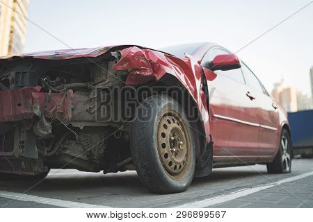 Red Car With Rumpled Bonnet And Bumper
Old Car With Rumpled Metal Bonnet Parked On Paved Parking Spo