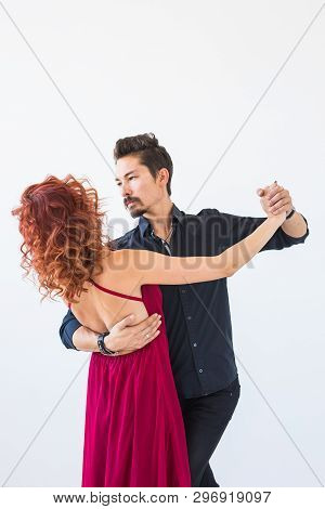 Social Dance, Bachata, Kizomba, People Concept - Young Pretty Woman In Pink Dress And Man Dancing Wa