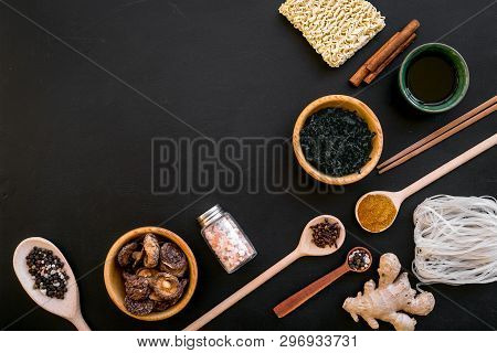 Geometric Design With Chinese, Japanese Products, Noodles, Weeds. Spices, Mushrooms On Black Backgro