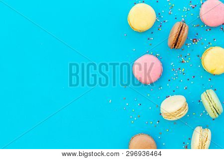Brignt Macarons For Sweet Break On Blue Background Top View Mock Up