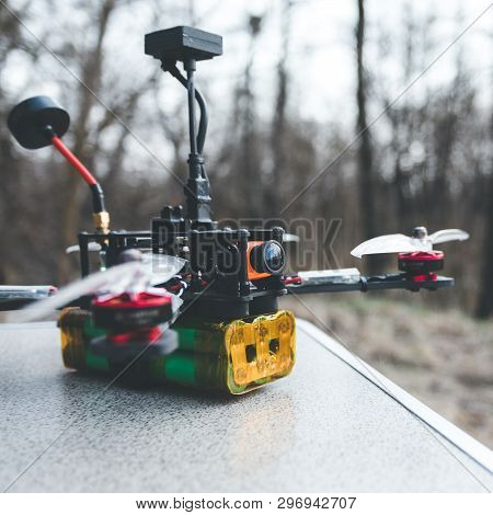 Fpv Drone Lies On The Table. The Pilot Sets Up His Racing Drone Before The Flight.