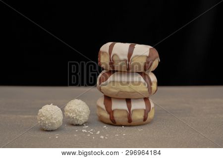 Sweet Cream Cake On A Gray Background And Round Rafaelo Sweets