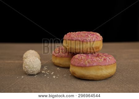 Sweet Cream Cake On A Gray Background And Round Rafaelo Sweets
