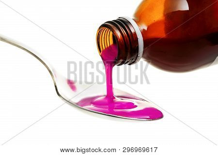Pouring Cough Or Antipyretic Syrup On Spoon Isolated On White