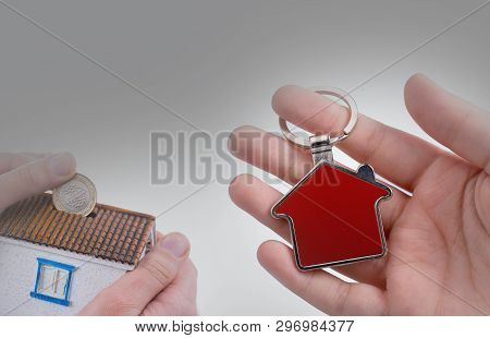 Hand Holding A House Icon In Hand On A Background